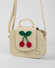 Bolso tejido con cerezas y botón de imán para niña