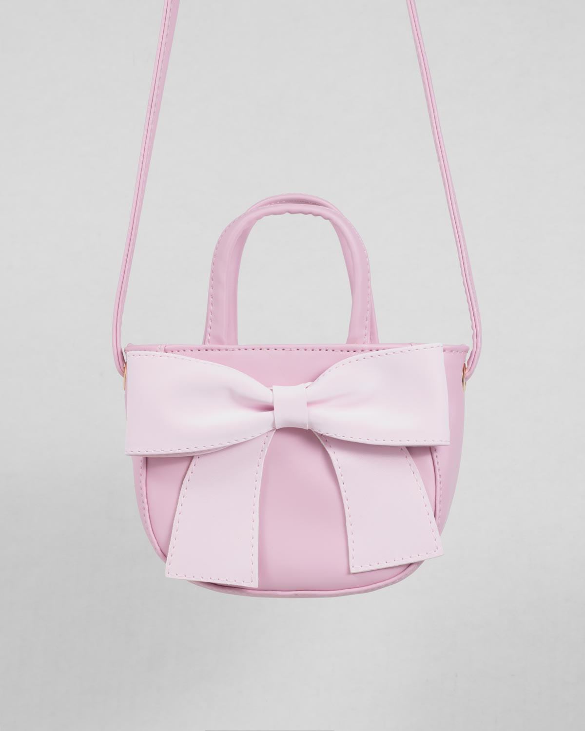 Bolso rosa con moño para niña