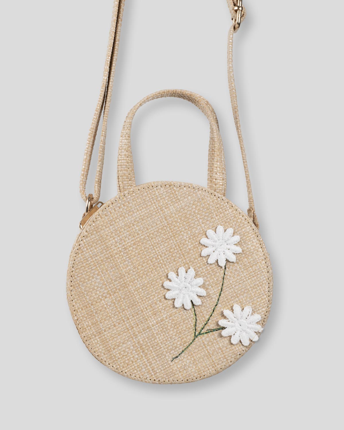 Bolso redondo tejido con flores para niña
