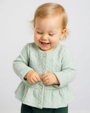 Saco en tela tejida verde con brillos y botones para bebé niña