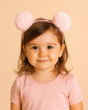 Diadema rosa con pompones para niña