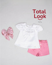 Total look con conjunto y moño pinza rosa para niña