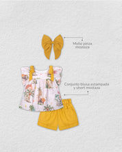 Total look de conjunto mostaza con moño pinza para niña.