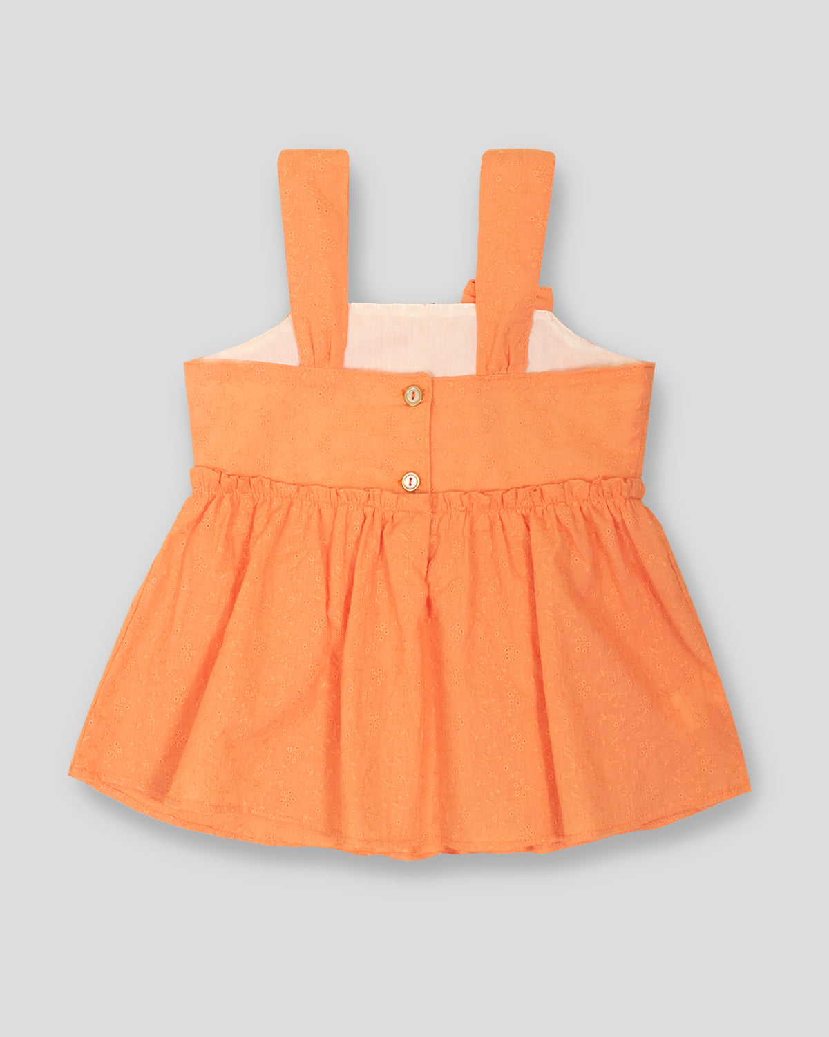 Blusa de tiras naranja con moño para niña
