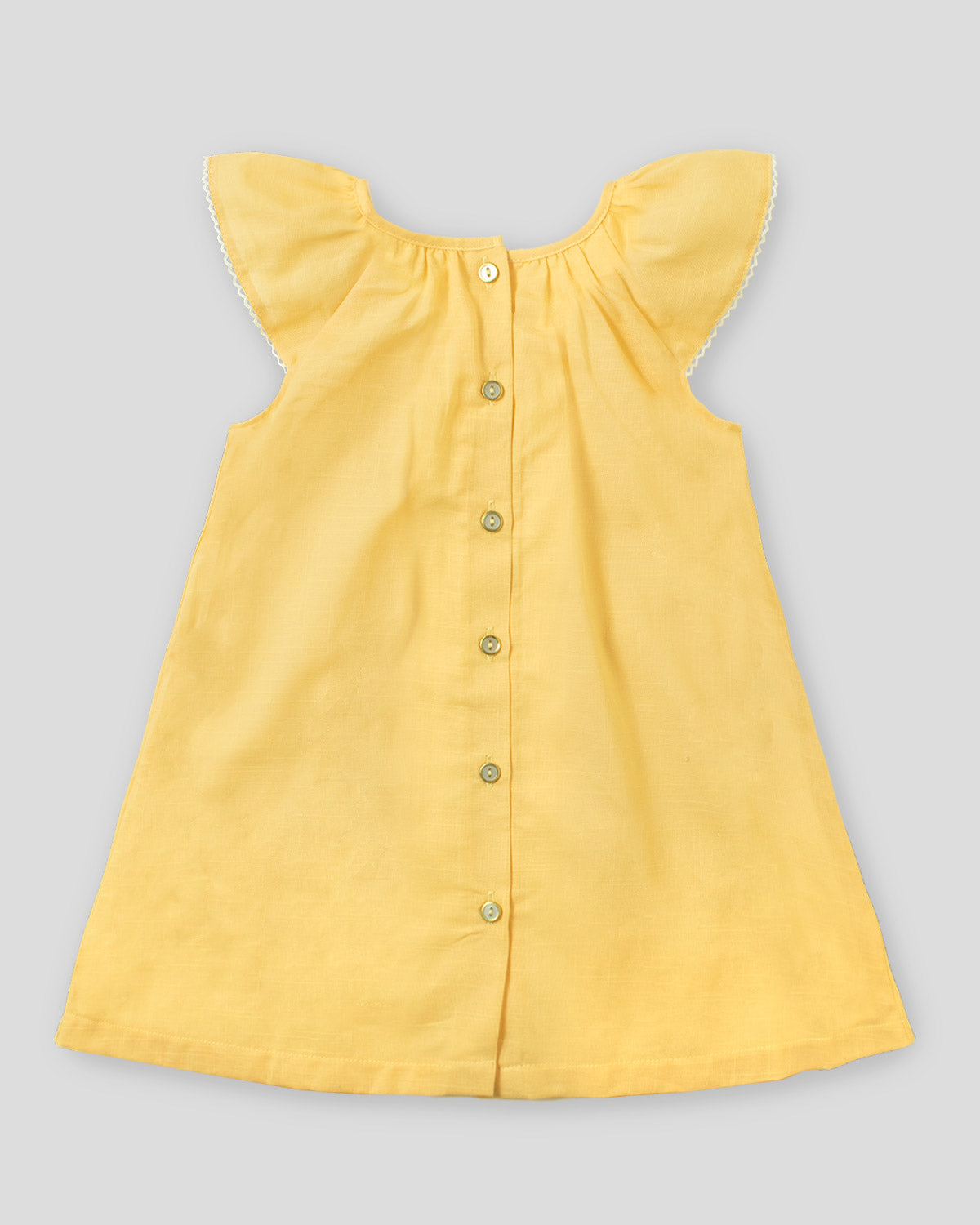 Vestido amarillo don bordado de flores  y botonadura en espalda para niña
