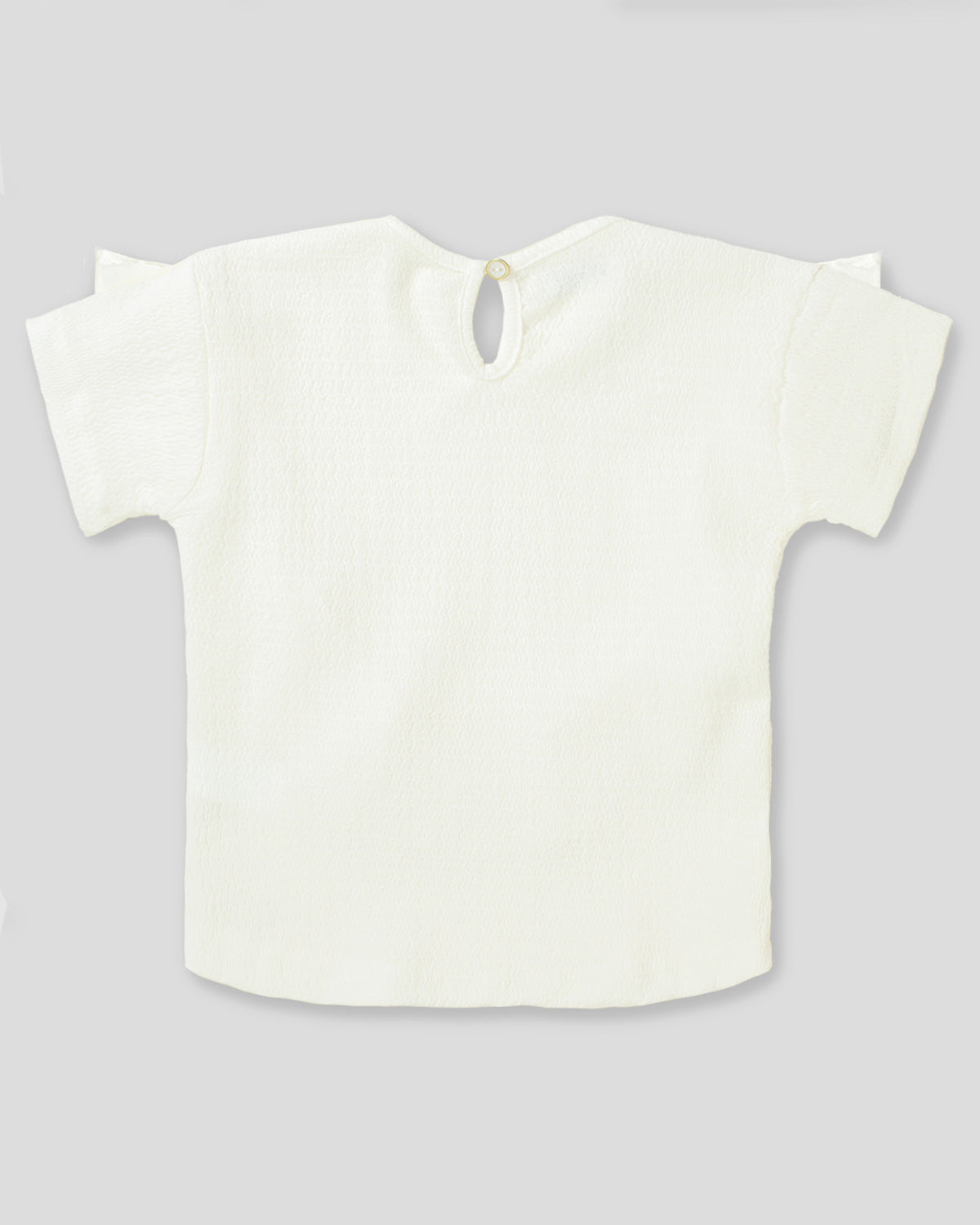 Blusa beige con detalle de bolero y botón en espalda para niña