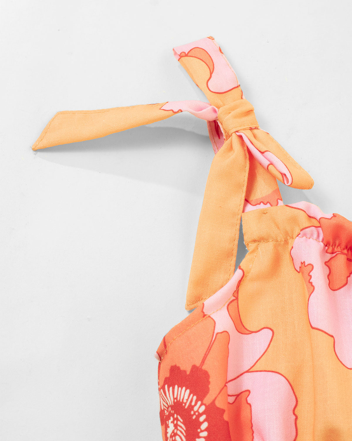 Vestido flores naranjas con moño en tiras