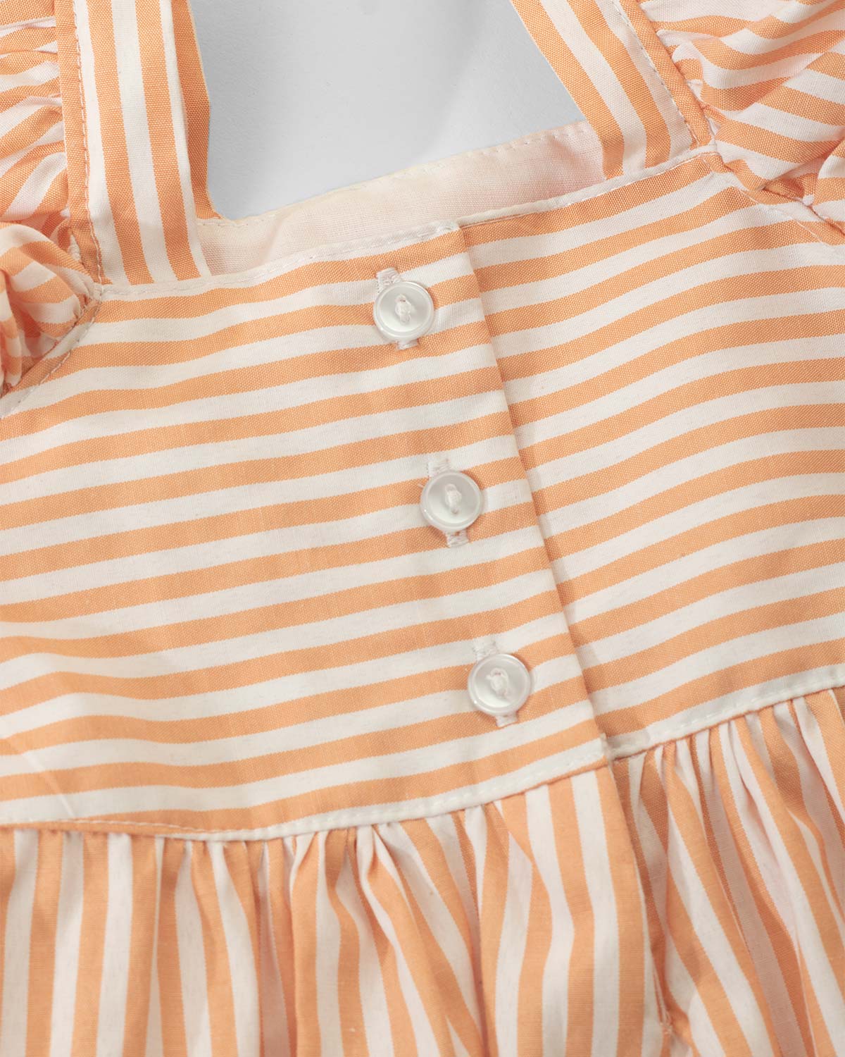 Vestido largo de líneas naranjas para niña