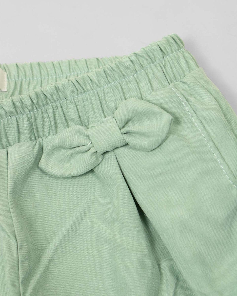 Pantalón mom fit resortado verde con moños para bebé niña - Cielito